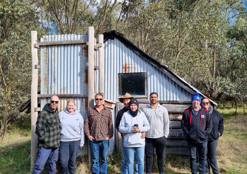 Members of the VFWDC in front of  a hut.